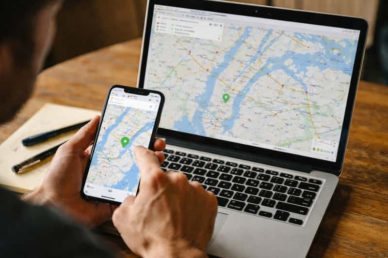 Google Maps interface on smartphone screen showing route between two locations with midpoint marker highlighted on the map di